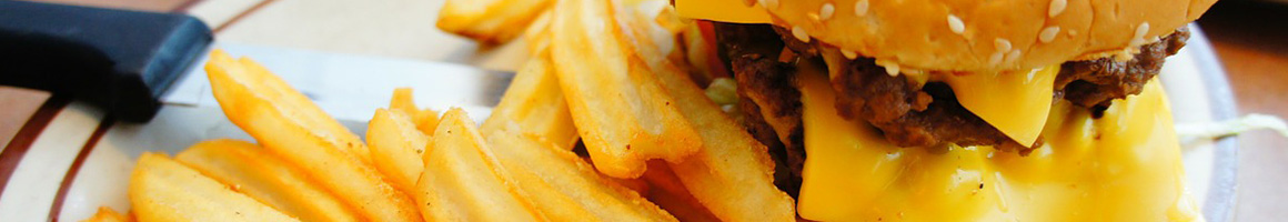 Eating American (Traditional) Burger Fast Food at Atomic Burger restaurant in Metairie, LA.